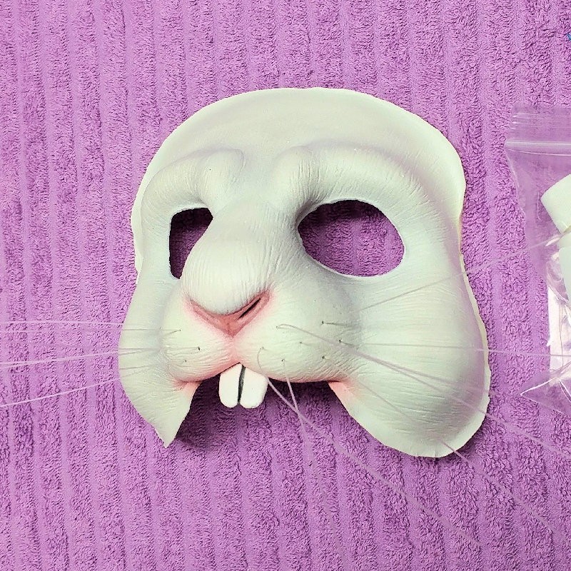 Rabbit Face hot foam latex prosthetic painted in white with optional rodent teeth and whiskers.