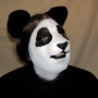 Man wearing foam latex prosthetic nose and makeup to look like an anthropomorphic panda Man wearing foam latex prosthetic nose and makeup to look like an anthropomorphic panda