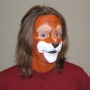 Man wearing foam latex prosthetic nose and makeup to look like an anthropomorphic brown squirrel.
