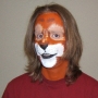Man wearing foam latex prosthetic nose and makeup to look like an anthropomorphic brown squirrel.