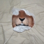 a painted slush cast latex prosthetic Small Rodent Nose placed on tissue paper