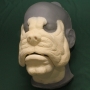 Foam latex prosthetic Bulldog Face placed on a plastic human face cast