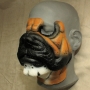 Bulldog Face hot foam latex prosthetic painted as a bulldog with brown, black and white, placed on a plastic human face cast