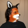 Man wearing latex prosthetic nose and makeup to look like an anthropomorphic fox.