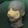 Small Fox Nose slush cast latex porsthetic placed on a plastic human face cast