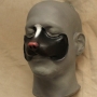 Small Fox Nose foam latex prosthetic placed on a plastic human face cast, painted as a skunk