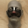 Small Fox Nose foam latex prosthetic placed on a plastic human face cast, painted as a skunk