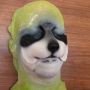 Small Fox Nose foam latex prosthetic placed on a plastic human face cast, painted as a raccoon