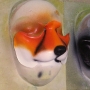 Small Fox Nose slush cast latex prosthetic placed on a plastic human face cast, painted as a fox