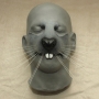 a painted foam latex prosthetic Large Rodent Nose placed on a plastic human face cast