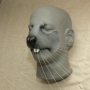a painted foam latex prosthetic Large Rodent Nose placed on a plastic human face cast
