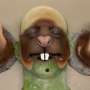 a painted foam latex prosthetic Large Rodent Nose placed on a plastic human face cast