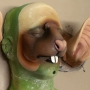 a painted foam latex prosthetic Large Rodent Nose placed on a plastic human face cast