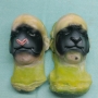 Two foam latex prosthetic Sheep / Goat Noses painted dark grey and black placed on plastic human face casts. One has a pink nose. Two foam latex prosthetic Sheep / Goat Noses painted dark grey and black placed on plastic human face casts. One has a pink nose.