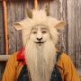 Man wearing foam latex prosthetic nose and makeup to look like an anthropomorphic white goat Man wearing foam latex prosthetic nose and makeup to look like an anthropomorphic white goat