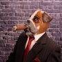 Man wearing foam latex prosthetic face and makeup to look like an anthropomorphic bulldog smoking a cigar Man wearing foam latex prosthetic face and makeup to look like an anthropomorphic bulldog smoking a cigar
