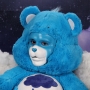 Man wearing latex prosthetic nose and makeup to look like an anthropomorphic Grumpy Bear.