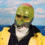Man wearing foam latex prosthetic face and makeup to look like an anthropomorphic salmon.