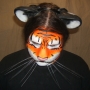 Man wearing foam latex prosthetic nose and makeup to look like an anthropomorphic orange tiger. Man wearing foam latex prosthetic nose and makeup to look like an anthropomorphic orange tiger.