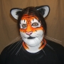 Man wearing foam latex prosthetic nose and makeup to look like an anthropomorphic orange tiger. Man wearing foam latex prosthetic nose and makeup to look like an anthropomorphic orange tiger.
