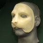 a slush cast latex prosthetic Cat Face placed on a plastic human face cast a slush cast latex prosthetic Cat Face placed on a plastic human face cast