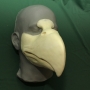 Foam latex prosthetic eagle beak placed on a plastic human face cast