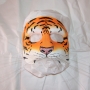 Foam Latex Cat Face is painted as an orange Bengal Tiger and placed on tissue paper. Foam Latex Cat Face is painted as an orange Bengal Tiger and placed on tissue paper.