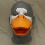 Foam Latex prosthetic Small Duck Bill placed on a plastic human face cast, painted in orange and white.