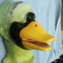 Foam Latex prosthetic Small Duck Bill placed on a plastic human face cast, painted in yellow and black.