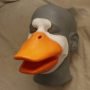 Foam Latex prosthetic Small Duck Bill placed on a plastic human face cast, painted in orange and white.