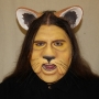 Man wearing foam latex prosthetic nose and makeup to look like the Cowardly Lion