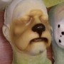 Foam Latex Cowardly Lion Nose is painted in tans and browns and placed on a plastic human face cast