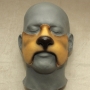 Foam Latex Cowardly Lion Nose is painted in tans and browns and placed on a plastic human face cast