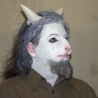 Man wearing foam latex prosthetic nose and makeup to look like an anthropomorphic white goat. Man wearing foam latex prosthetic nose and makeup to look like an anthropomorphic white goat.