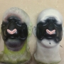 two foam latex prosthetic Sheep / Goat Noses painted black with pink noses placed on plastic human face casts two foam latex prosthetic Sheep / Goat Noses painted black with pink noses placed on plastic human face casts